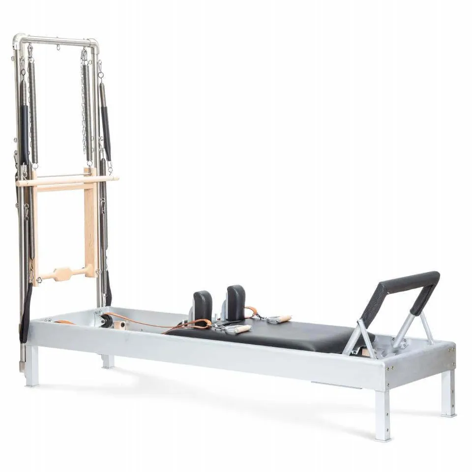 Reformer Pilates classique en aluminium avec tour Fougère, illustration du guide « Entretien reformer Pilates : checklist mensuelle complète »